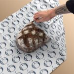 custom sandwich wrapping paper used in a deli food setting