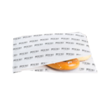 deli paper sheets stacked with sandwich and fries