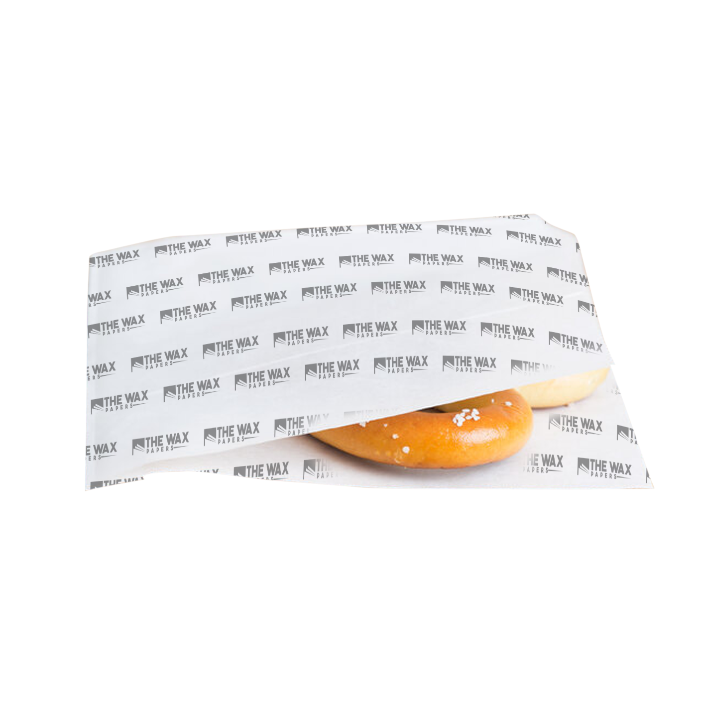 deli paper sheets stacked with sandwich and fries