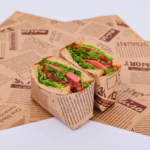 flat unwrapped sandwich wrap paper printed with repeating logo