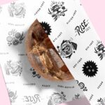 variety of custom printed food wrap paper sheets with different logos